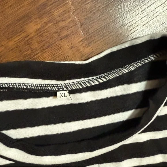 A black and white striped cold-shoulder top with long sleeves - Picture 5 of 7